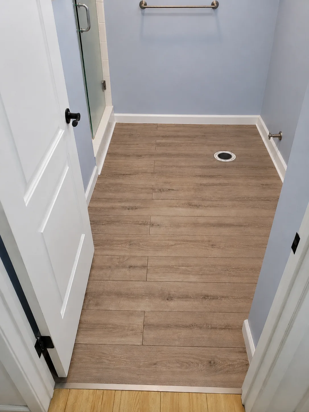 Wood-look flooring installed in a bathroom